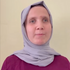 Emine Betül is smiling at the camera.